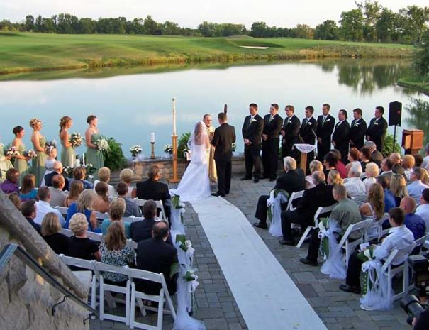 wedding vows on the patio overlooking the lake and golf course